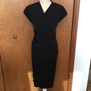 Formal black dress with cap sleeves and synched waist. Size 6.